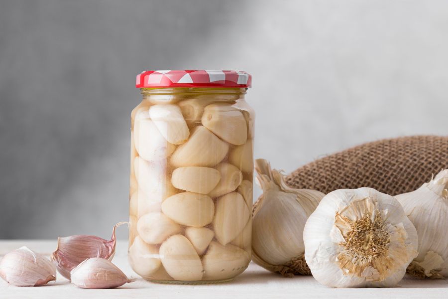 Mayo jar with pickled garlic