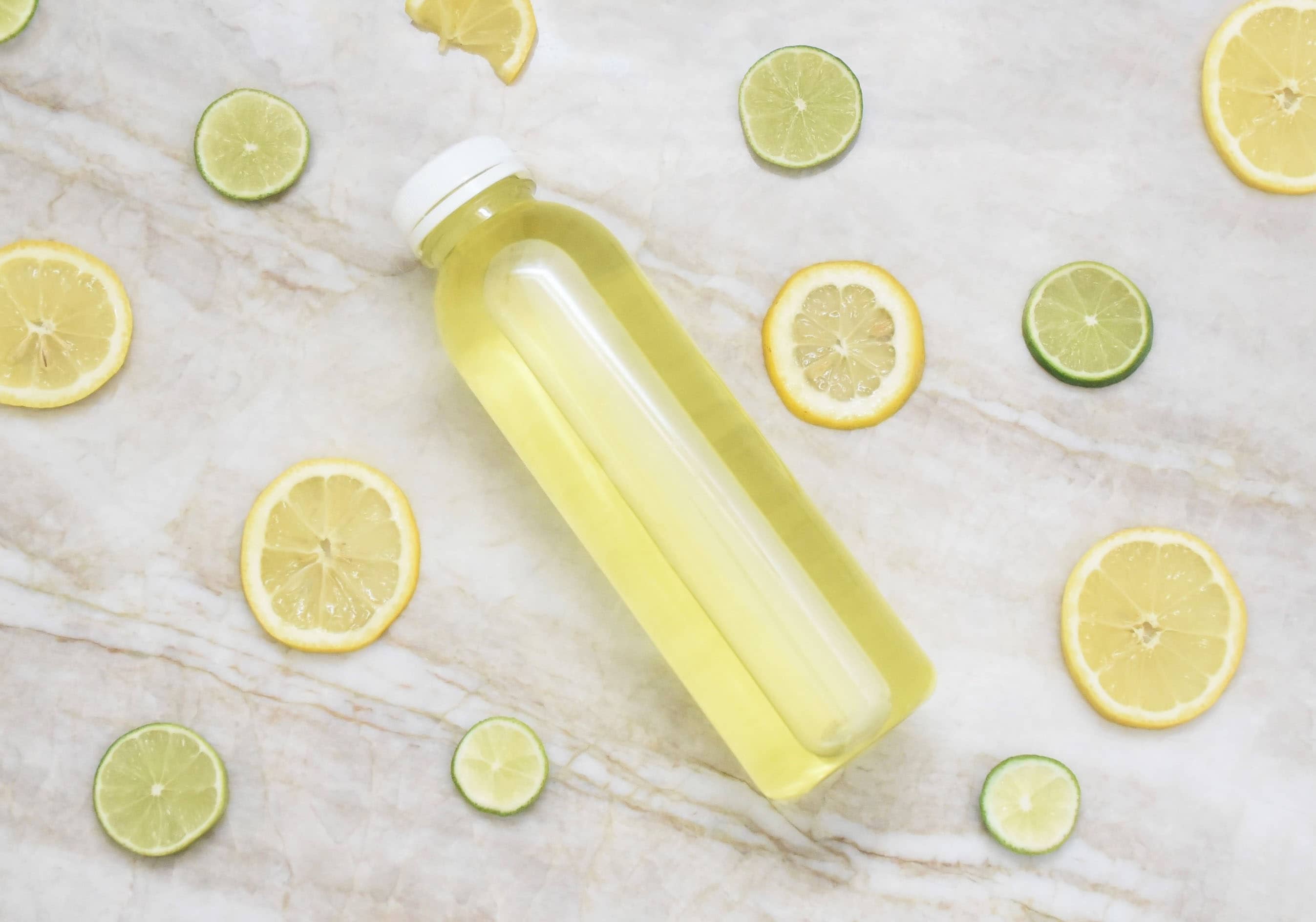 Bottled Drink with Lemons and Limes