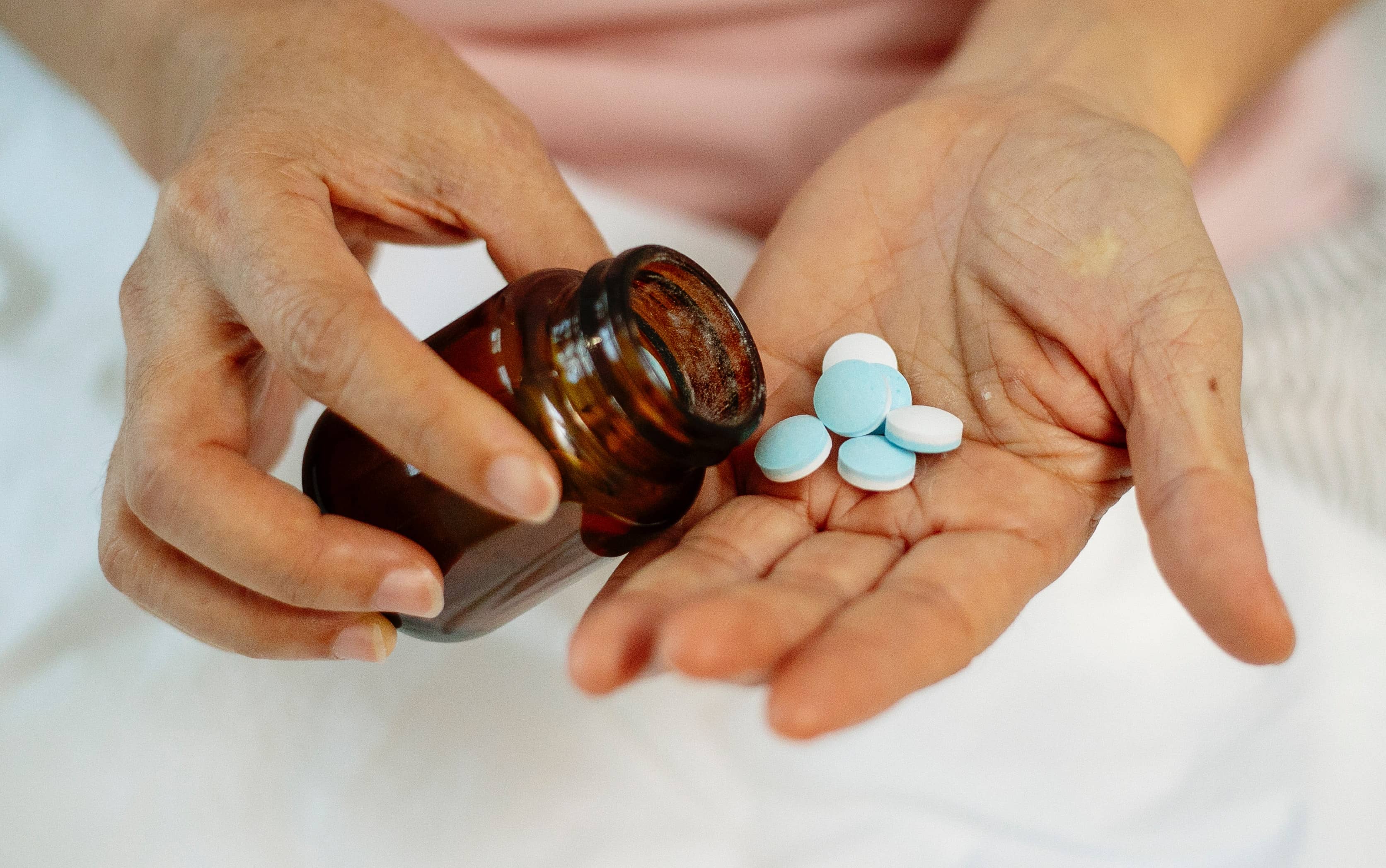 amber glass medicine bottle holding pills