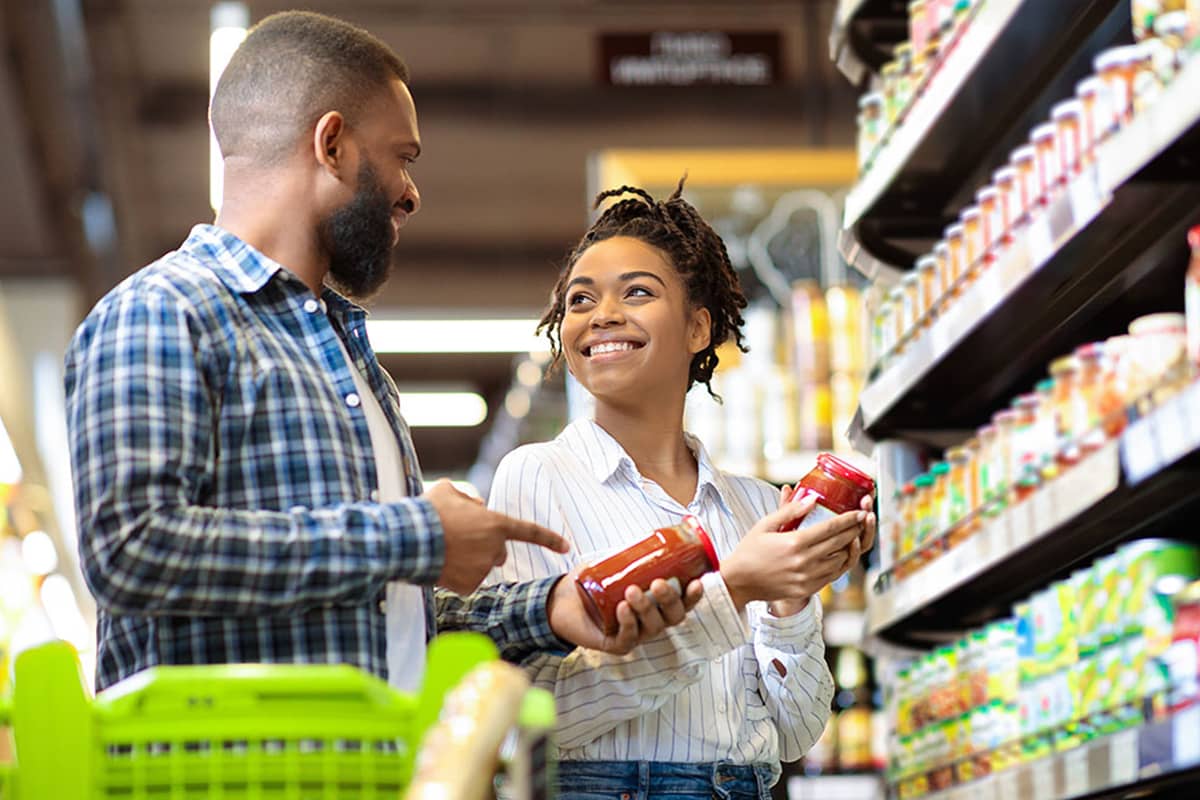 customers picking out food products at grocery store