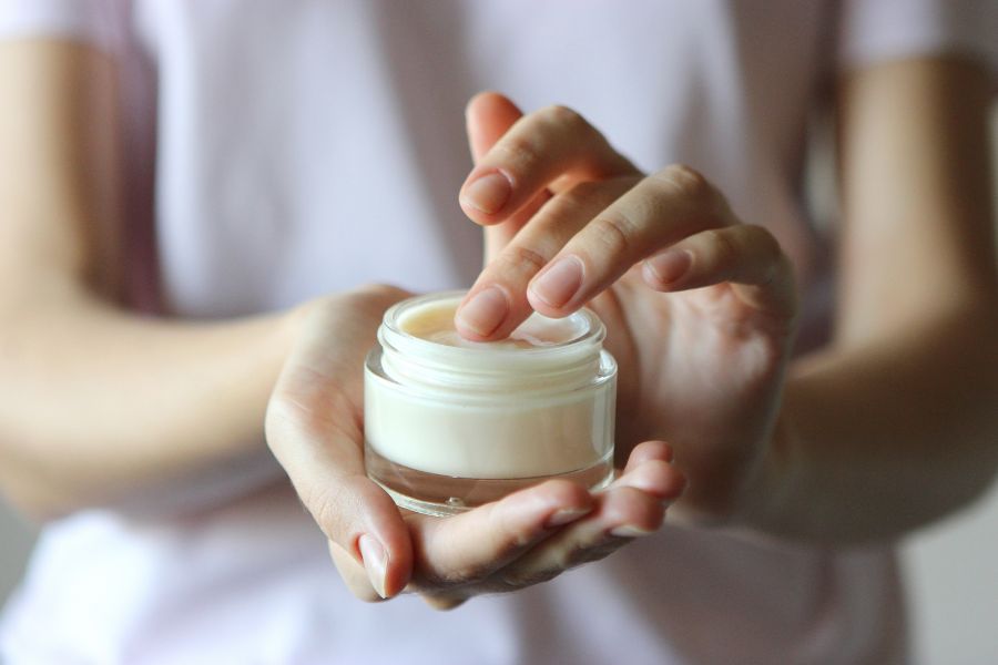 glass jar of face cream