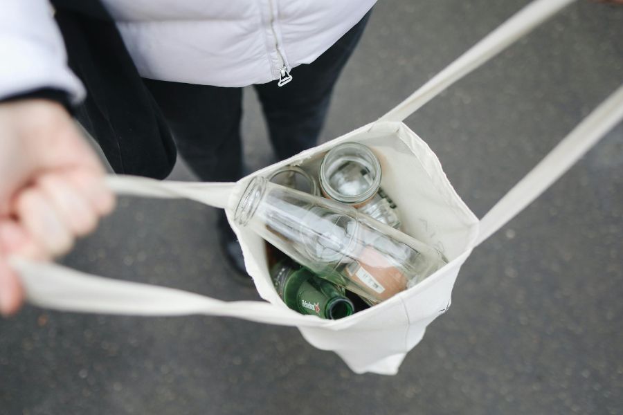 tote bag full of recyclable bottles and cans