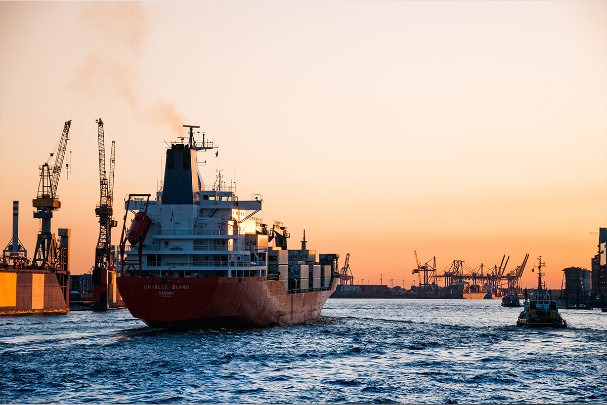 Image of cargo ship heading into a port