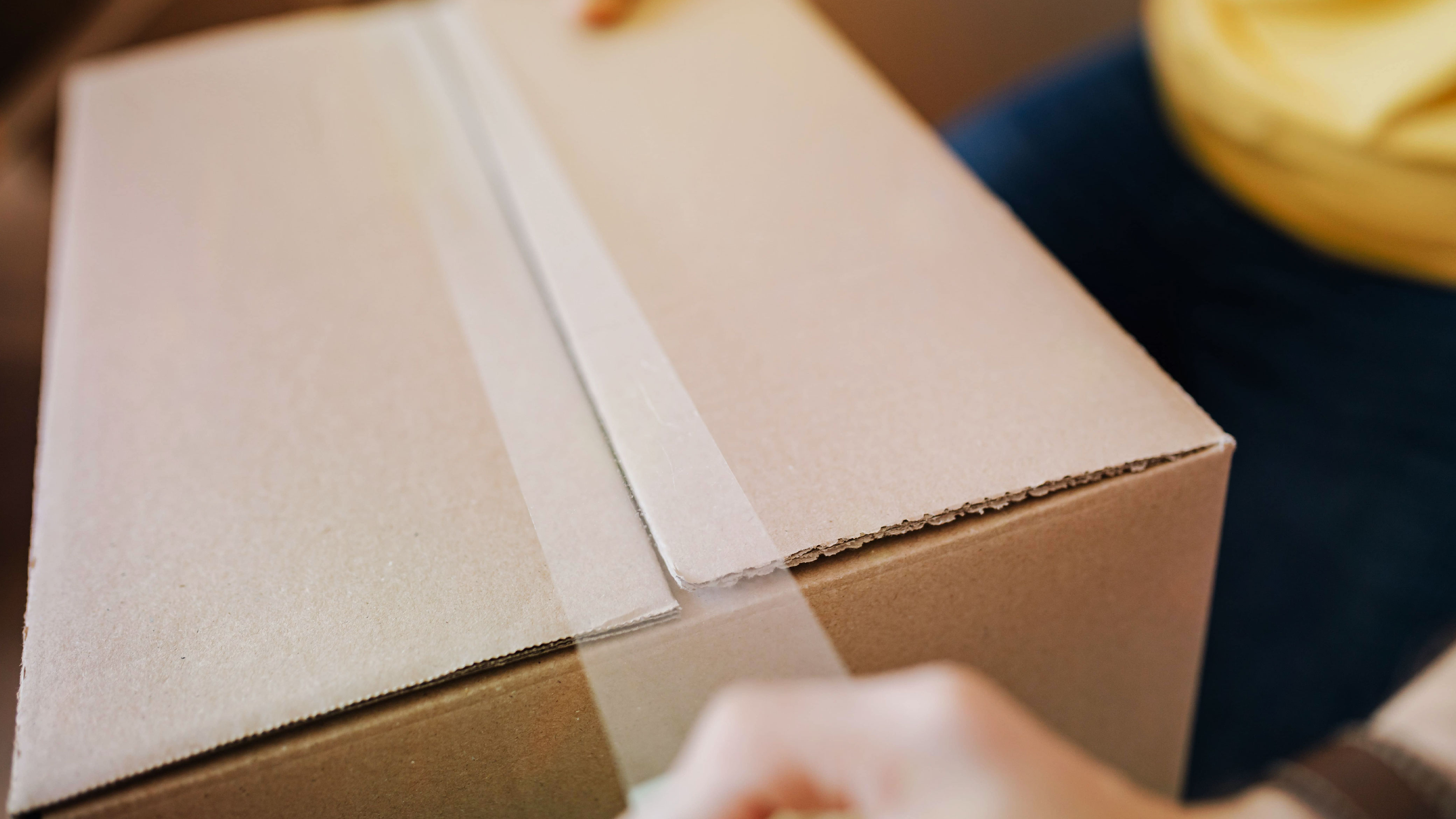 items sealed in shipping box with packaging tape