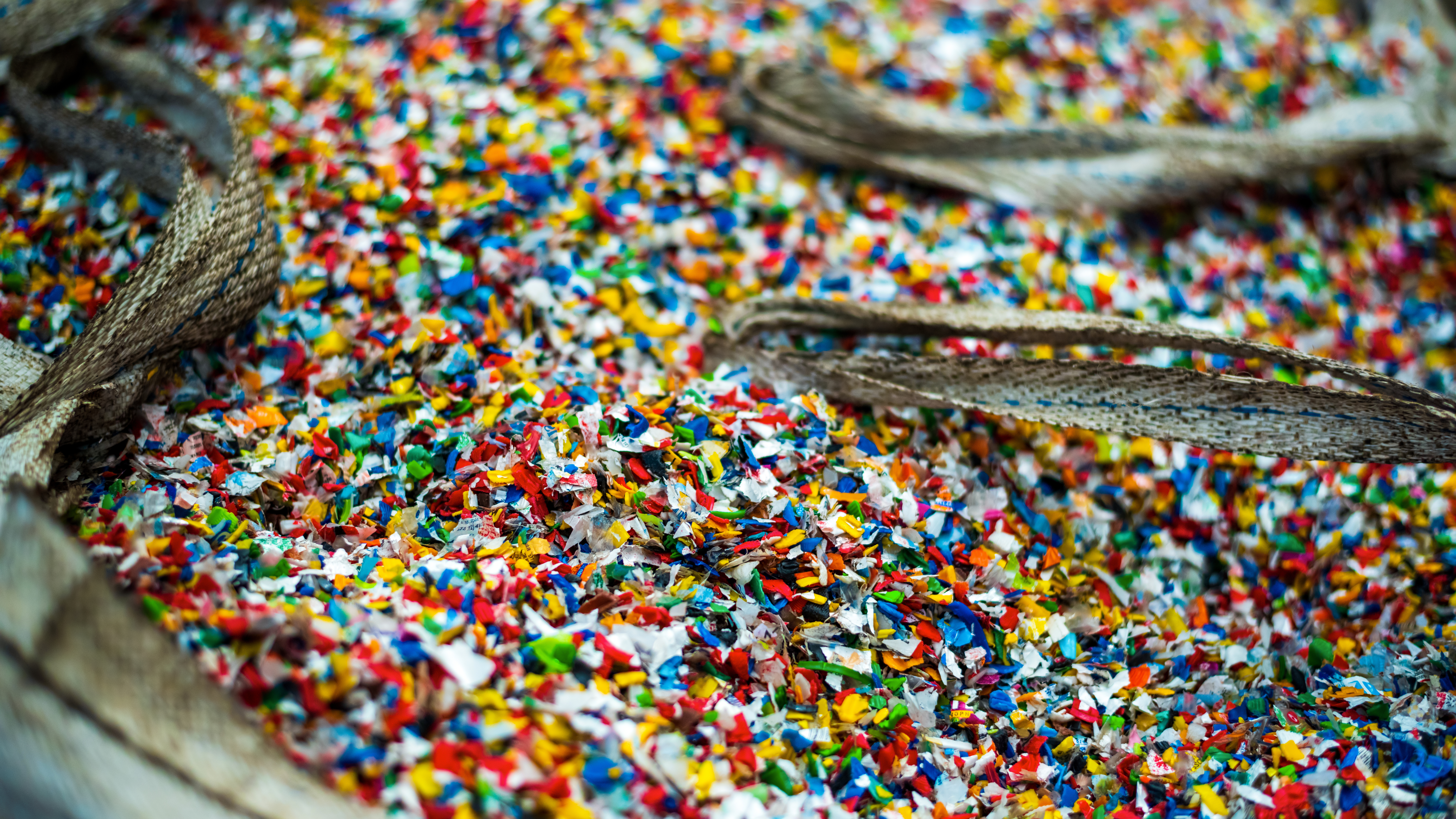 sack of mixed colors of post consumer recycled resin pellets