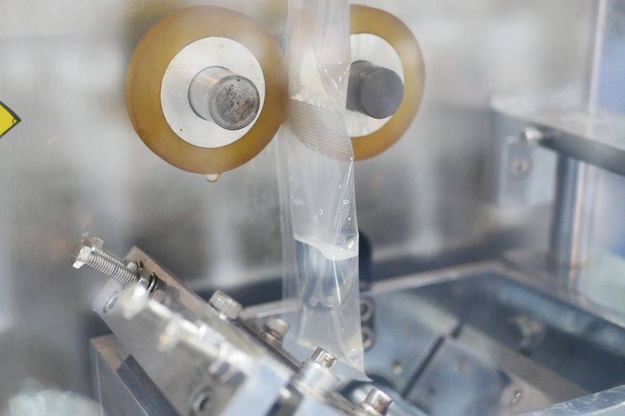 plastic bags being sealed with a machine