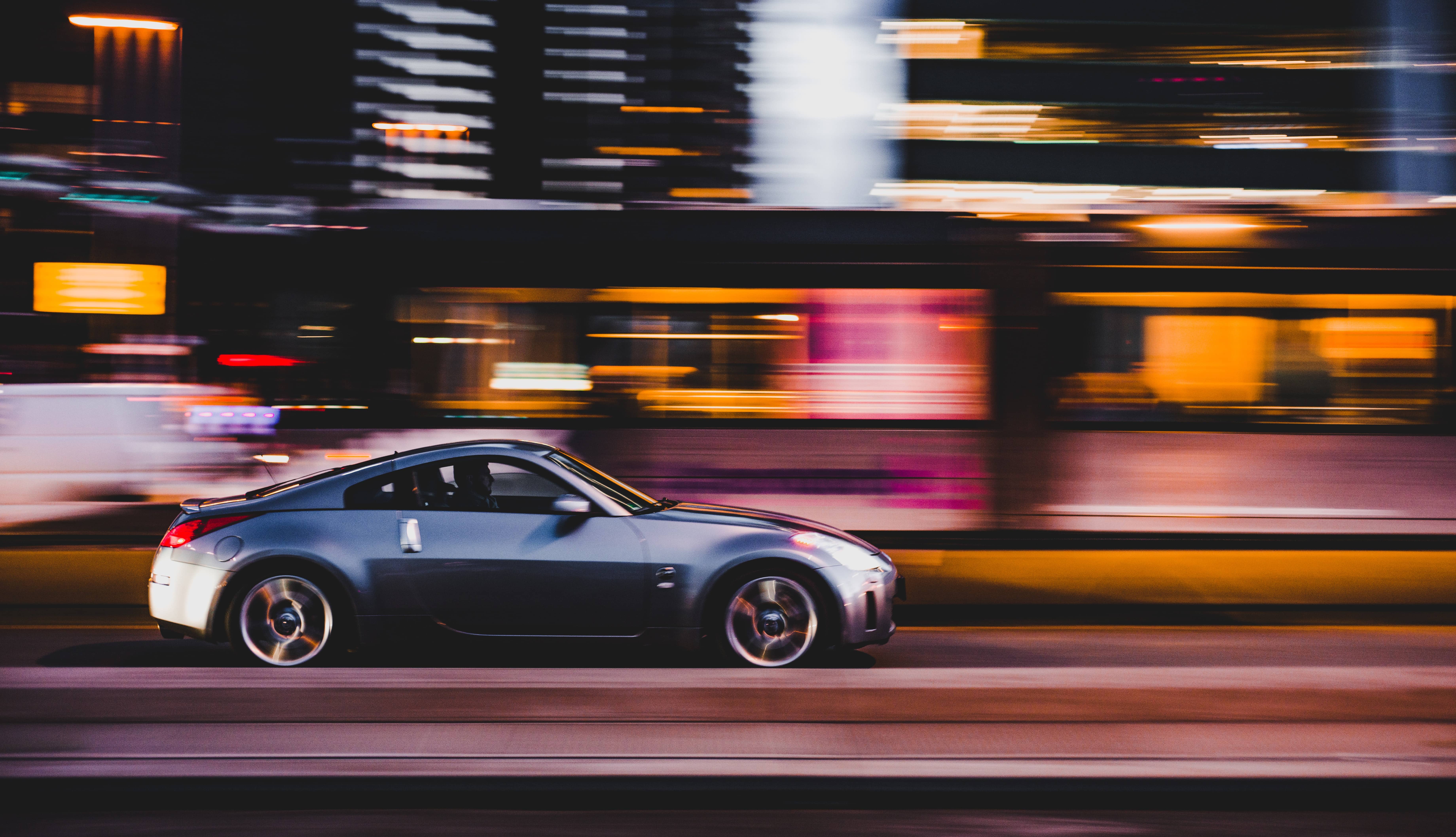 Car Driving with Blurred City Background