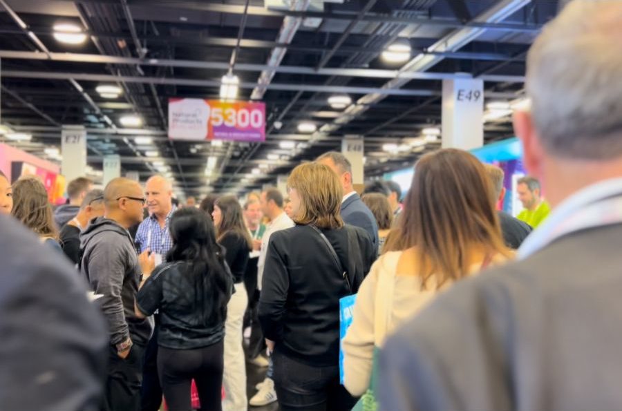 Attendees bustling around a trade show expo hall