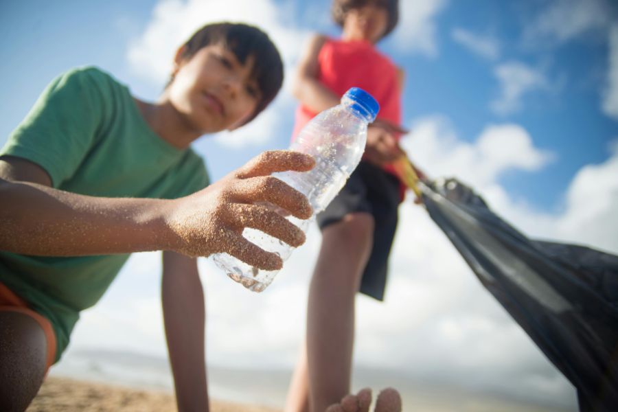 Person collecting plastic waste to be recycled