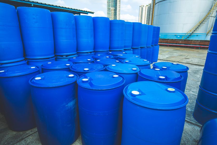 blue plastic 55-gallon drums