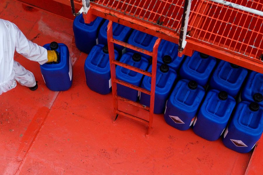 Blue HazMat Tight Head Barrels in warehouse
