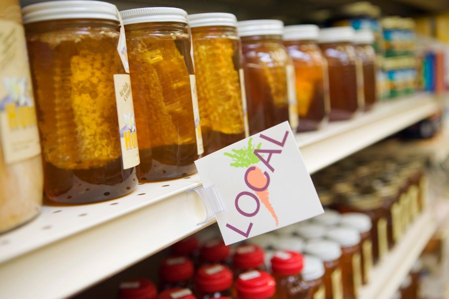 glass jars for honey food packaging on retail shelf