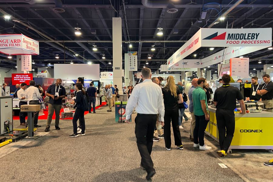 Visitors walk the show floor at PACK EXPO 2025 in Las Vegas