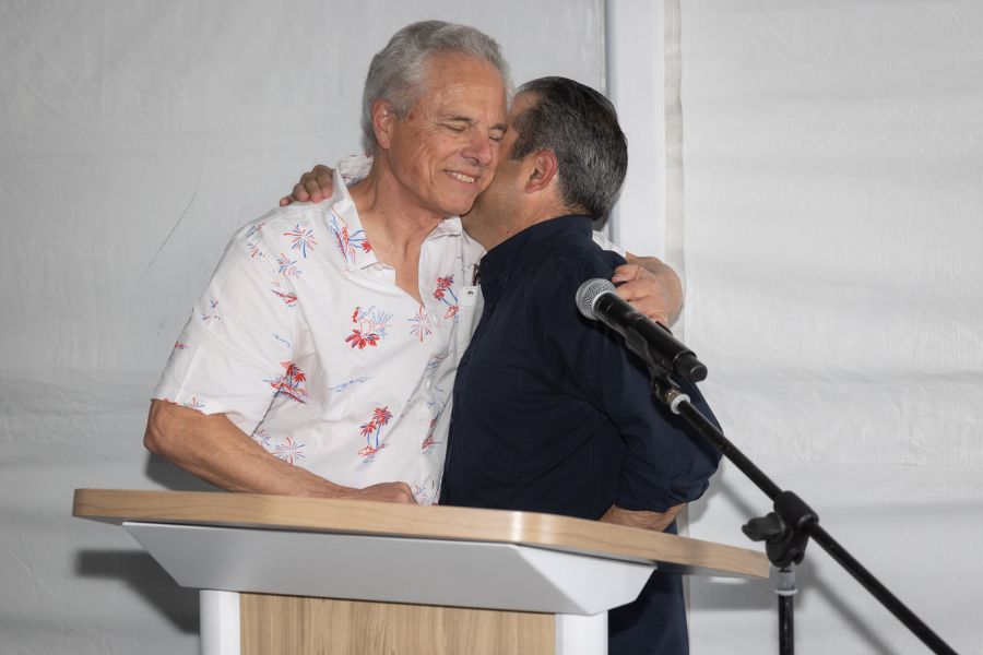 Jack and Jay Gample embrace at Paramount 50 year anniversary party